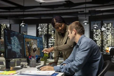 Diverse team of engineers using artificial intelligence to design a floor plan 스톡 사진