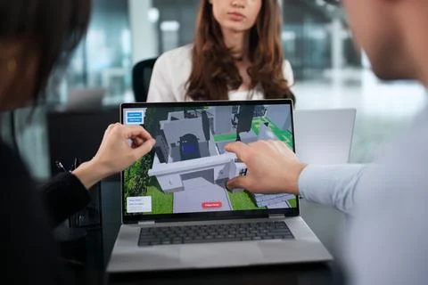 Diverse Team Of Engineers Using CAD Software For Home Construction. Stock Photos