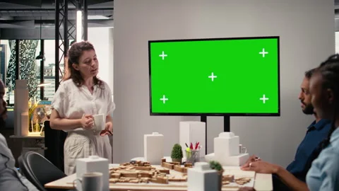 Diverse team exploring zoning regulations next to isolated display Stock Footage 316794867