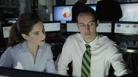 Diverse team of financial traders at work in a busy office Stock Footage 22825925