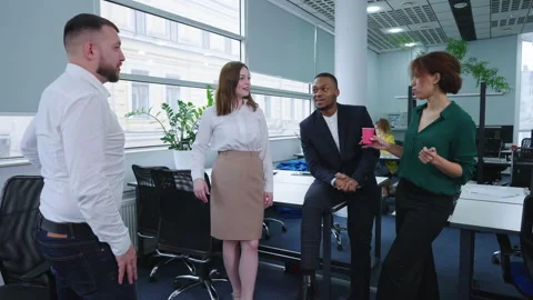 Diverse team having coffee break in office Stock Footage 163338891
