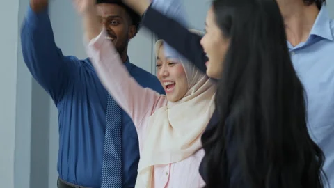 Diverse team joining hands in unity Stock Footage 288120383