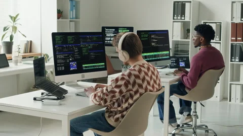 Diverse Team of Male IT Developers Coding on Computers in Open Plan Office Stock Footage 330128058