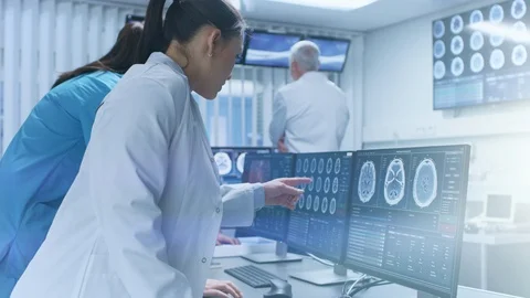 Diverse Team of Medical Scientists Solve Problems and Point at Computer Screen Stock Footage 91765053