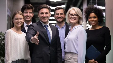 Diverse team meet welcome newcomer at new workplace Stock Photos