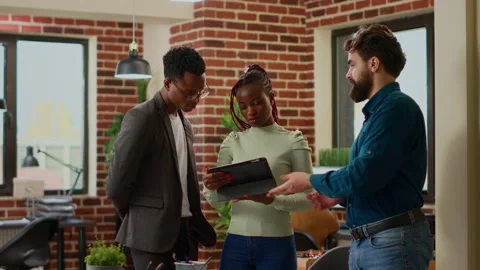 Diverse team of people doing teamwork to plan report analysis Stock Footage 220811192