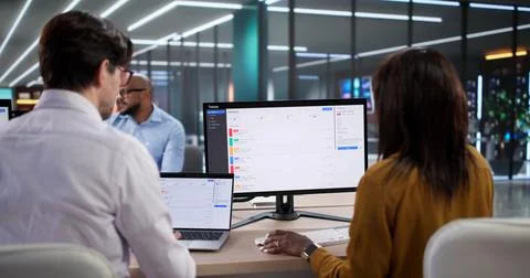 Diverse Team Of People Using Computers For Technical Support And Diagnostics. Stock Photos