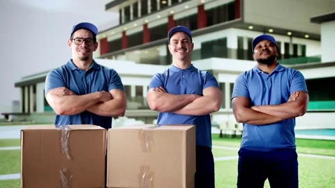 Diverse Team Of Professional Movers Delivering Boxes Stock Footage 299961189