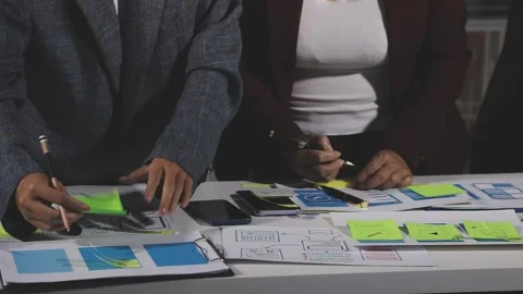 Diverse team of professionals engaged in a website graphic design board mee.. Stock Footage 316145386