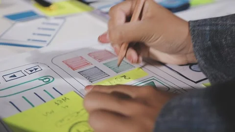 Diverse team of professionals engaged in a website graphic design board mee.. Stock Footage 316145624