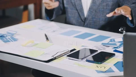 Diverse team of professionals engaged in a website graphic design board mee.. Stock Footage 317429332