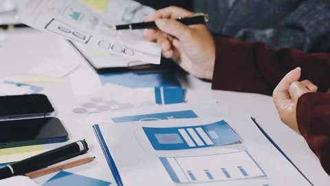 Diverse team of professionals engaged in a website graphic design board mee.. Stock Footage 317429333