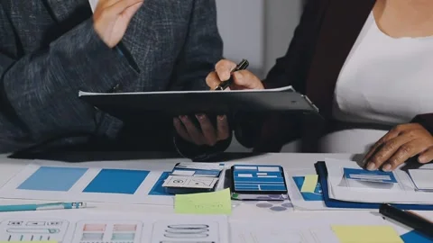Diverse team of professionals engaged in a website graphic design board mee.. Stock Footage 317429340