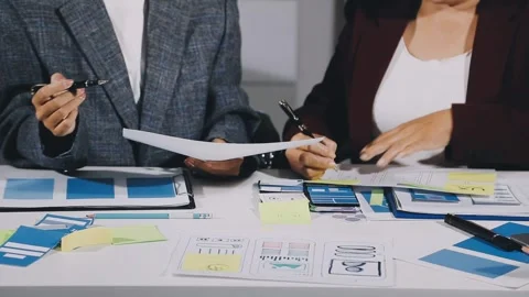 Diverse team of professionals engaged in a website graphic design board mee.. Stock Footage 317429350