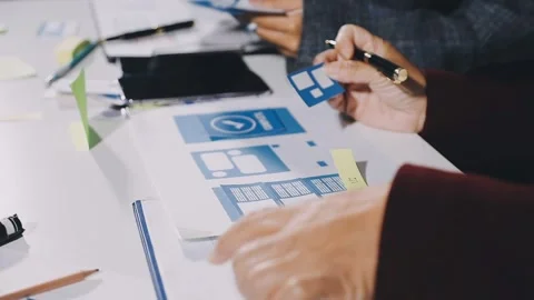 Diverse team of professionals engaged in a website graphic design board mee.. Stock Footage 317429351