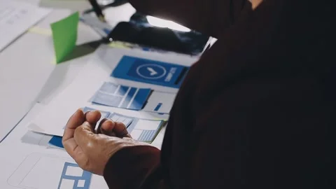 Diverse team of professionals engaged in a website graphic design board mee.. Stock Footage 317429353