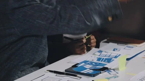 Diverse team of professionals engaged in a website graphic design board mee.. Stock Footage 317429358
