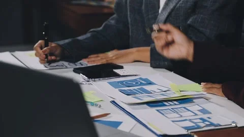 Diverse team of professionals engaged in a website graphic design board mee.. Stock Footage 317429362