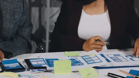 Diverse team of professionals engaged in a website graphic design board mee.. Stock Footage 317429365