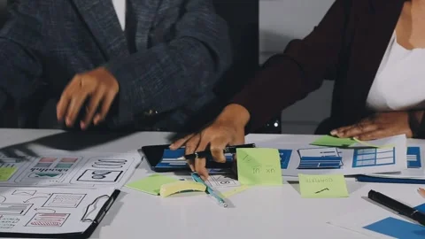Diverse team of professionals engaged in a website graphic design board mee.. Stock Footage 317429368
