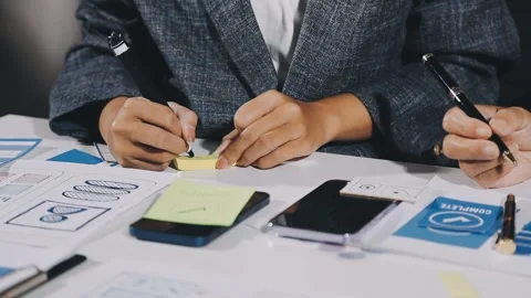 Diverse team of professionals engaged in a website graphic design board mee.. Stock Footage 317429369