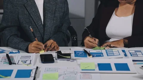 Diverse team of professionals engaged in a website graphic design board mee.. Stock Footage 317429387