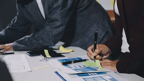Diverse team of professionals engaged in a website graphic design board mee.. Stock Footage 317429391
