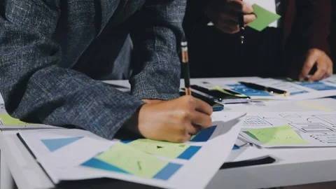 Diverse team of professionals engaged in a website graphic design board mee.. Stock Footage 317429396