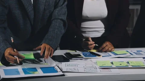 Diverse team of professionals engaged in a website graphic design board mee.. Stock Footage 317429405