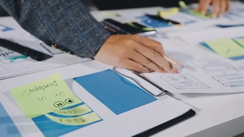 Diverse team of professionals engaged in a website graphic design board mee.. Stock Footage 317429412