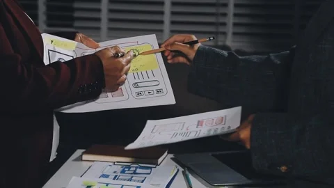Diverse team of professionals engaged in a website graphic design board mee.. Stock Footage 317429420
