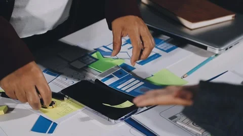Diverse team of professionals engaged in a website graphic design board mee.. Stock Footage 317429443