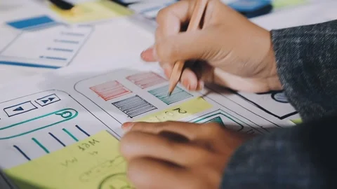 Diverse team of professionals engaged in a website graphic design board mee.. Stock Footage 317429445