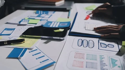 Diverse team of professionals engaged in a website graphic design board mee.. Stock Footage 317429449