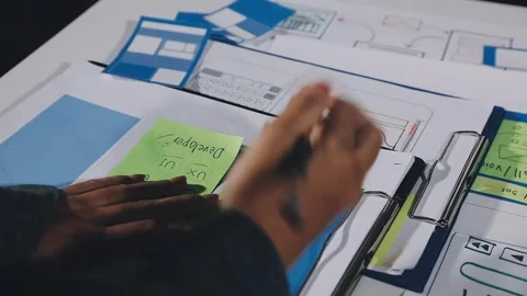 Diverse team of professionals engaged in a website graphic design board mee.. Stock Footage 317429464