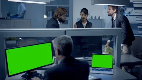 Diverse team of professionals working late at night watching data on computer. Stock Footage 119601951
