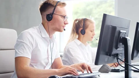 Diverse team of professionals is working in the phone support office. Working Stock Footage 161154084