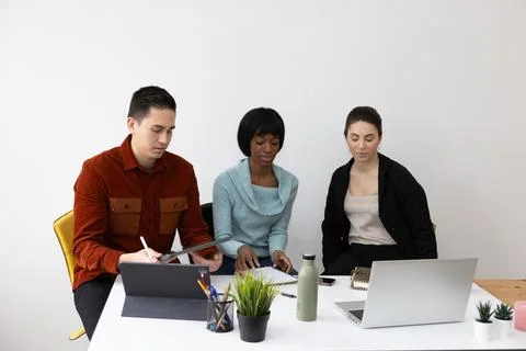 Diverse team of professionals working together on a project in the office 스톡 사진