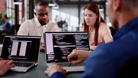 Diverse Team Of Programmers Coding Together Stock Footage 305880311
