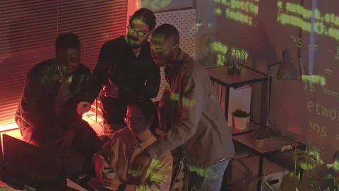 Diverse Team of Programmers Coworking at Night Stock Footage 165726384