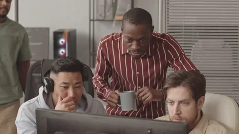 Diverse Team of Programmers Developing Video Game on PC Stock Footage 172192466