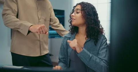 Diverse team programmers give fist bump to celebrate success at office. Stock Footage 344033286