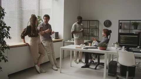 Diverse Team of Programmers Interacting at Workplace Stock Footage 255781601