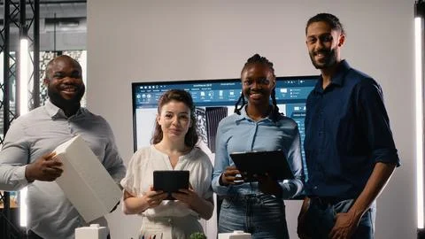 Diverse team of real estate developers using 3D models in a modern office Stock Photos