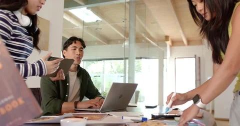 Diverse team reviewing mockups after tablet share, African American man at Stock Footage 335895802