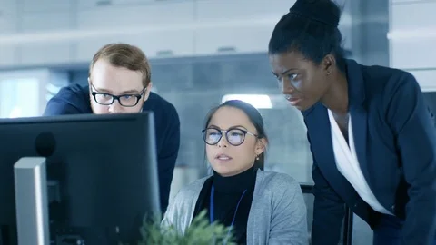 Diverse Team of Scientific Engineers Doing Research on a Computer  Stock Footage 76346771