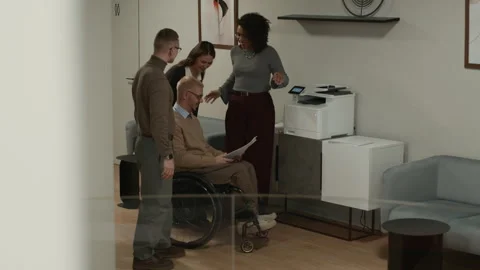 Diverse Team of Smiling Office Workers Meeting at Printer in Corridor Stock Footage 309038362