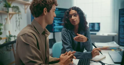 Diverse team software developer discuss AI coding and project at office. Stock Footage 343927412
