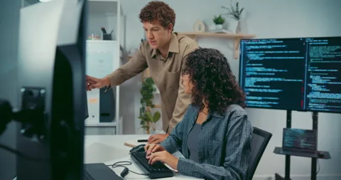 Diverse team software developer discuss AI coding and project at office. Stock Footage 343927646