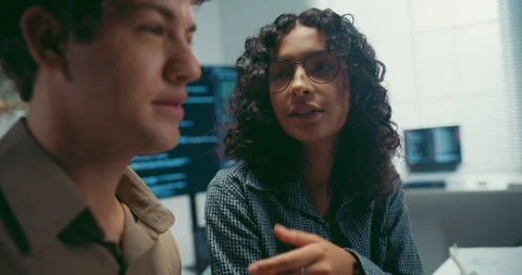 Diverse team software developer discuss AI coding and project at office. Stock Footage 343927834